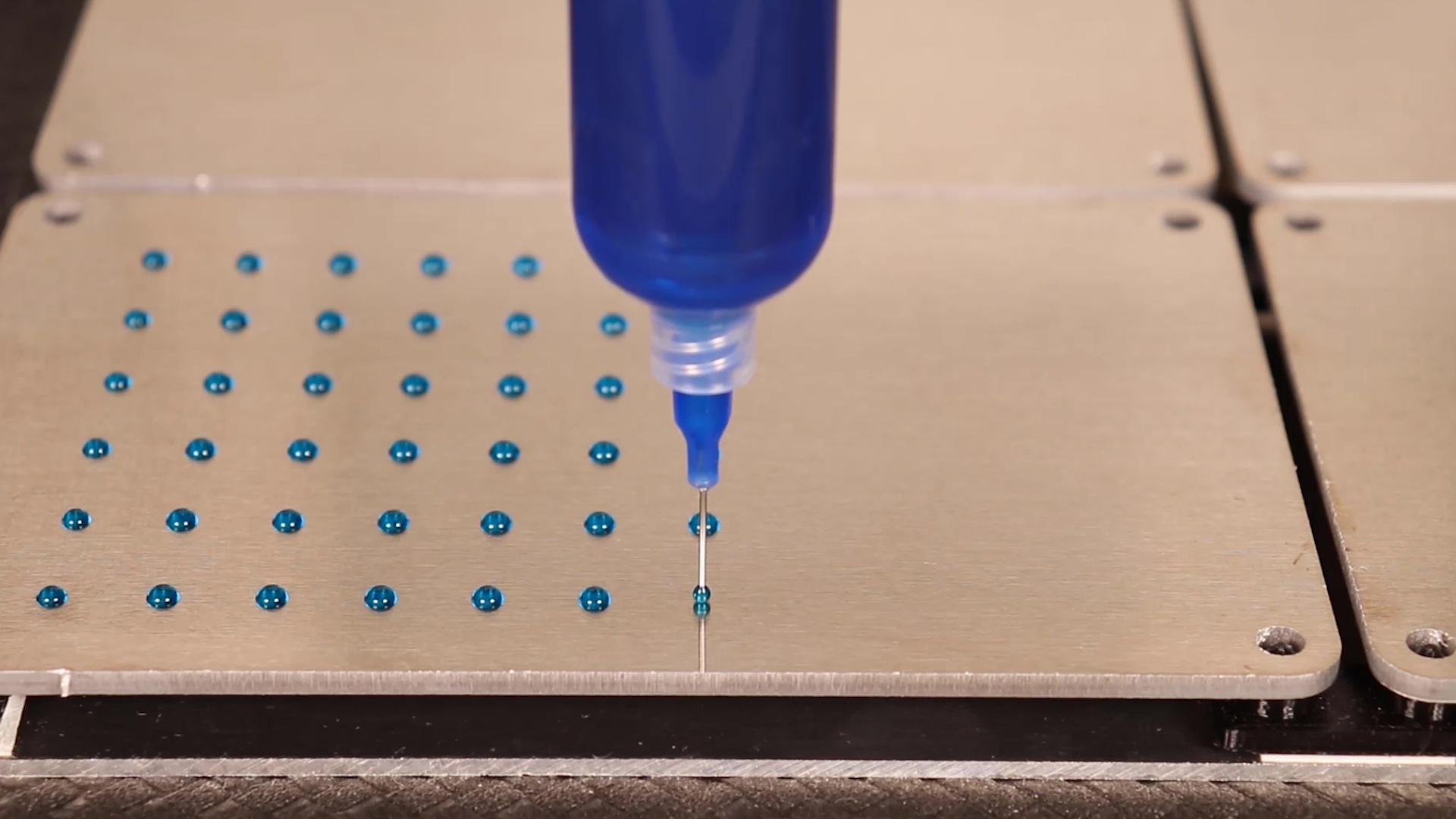 Dispensing of adhesive dots